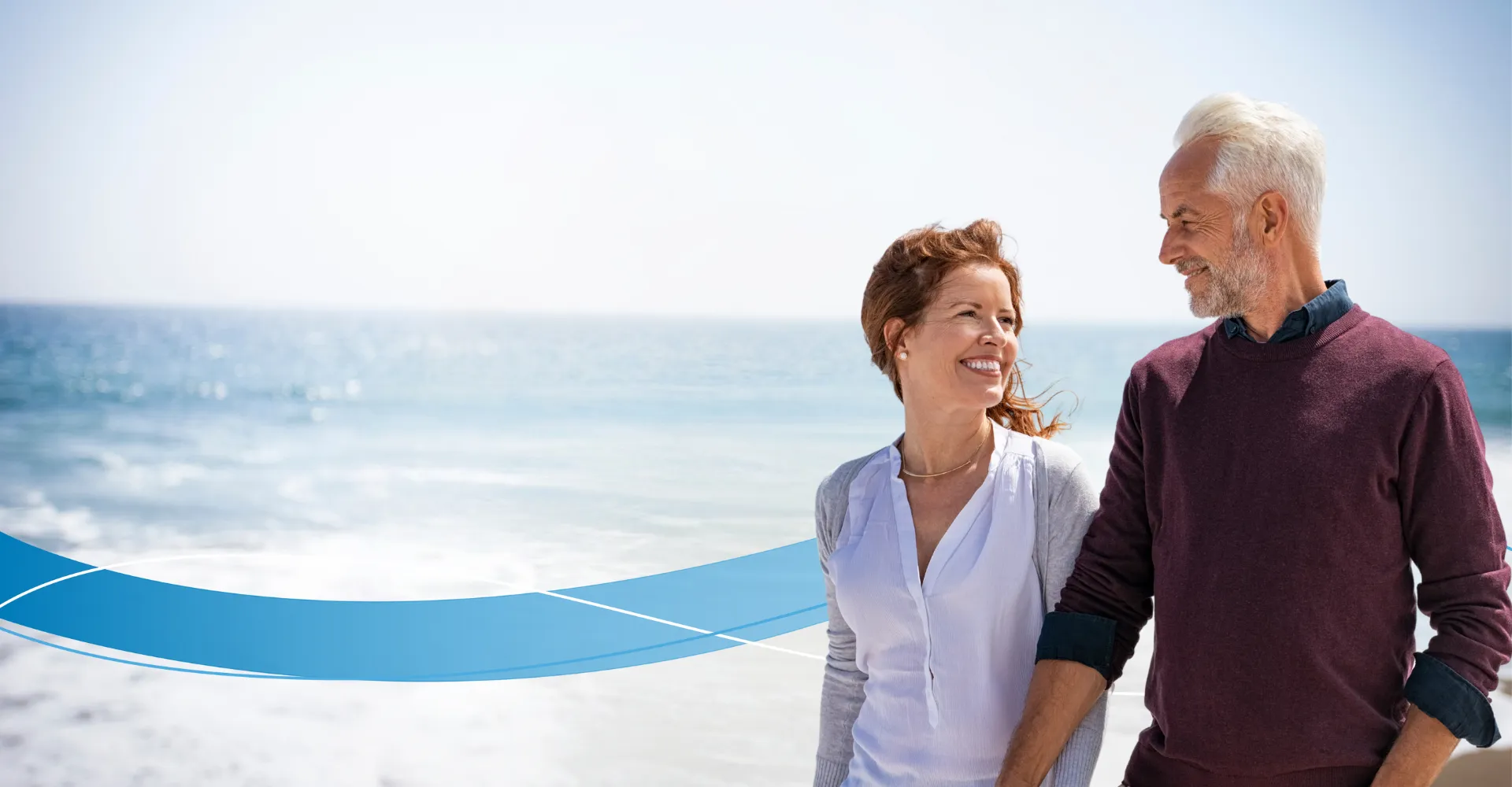Couple on beach smiling