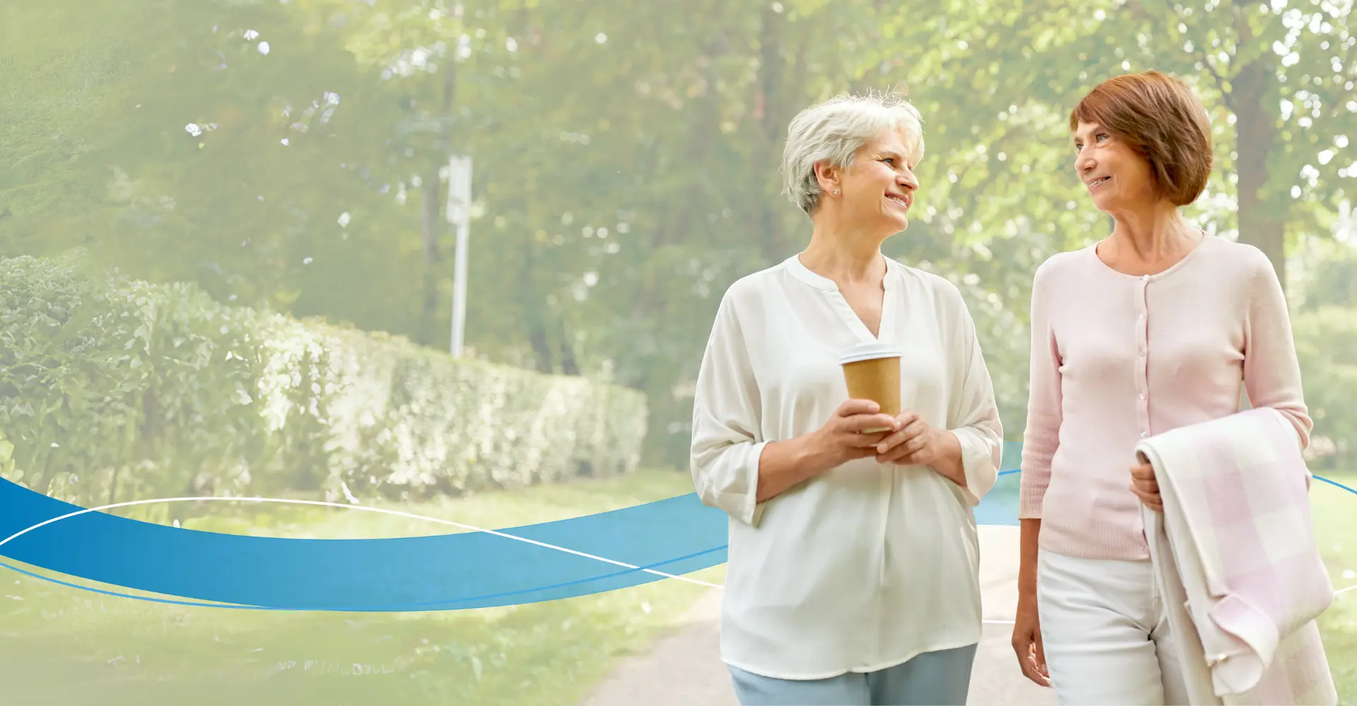 Two woman walking in a park