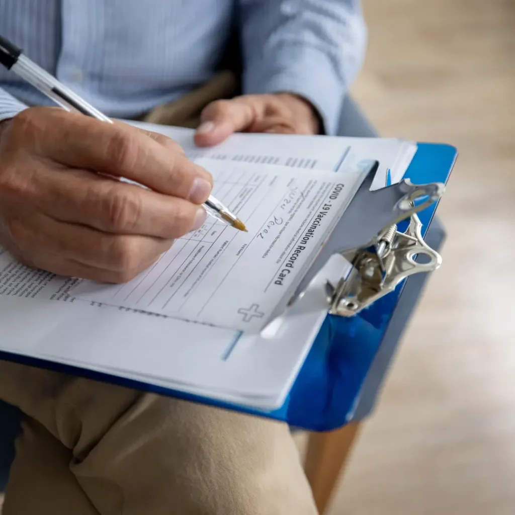 Doctor writing on a clipboard