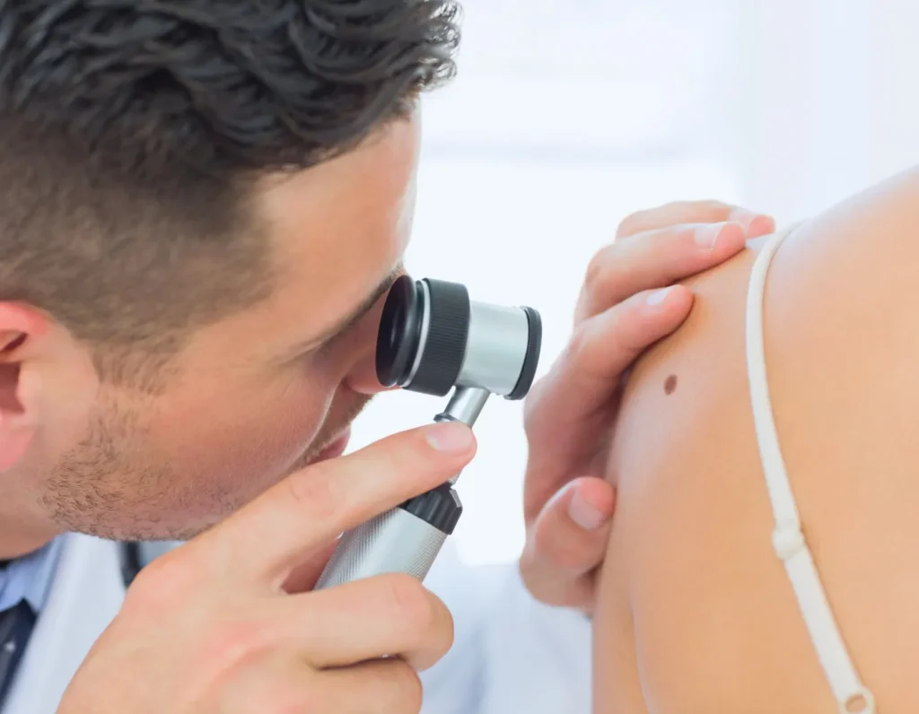 Physician looking at a patients skin (shoulder)